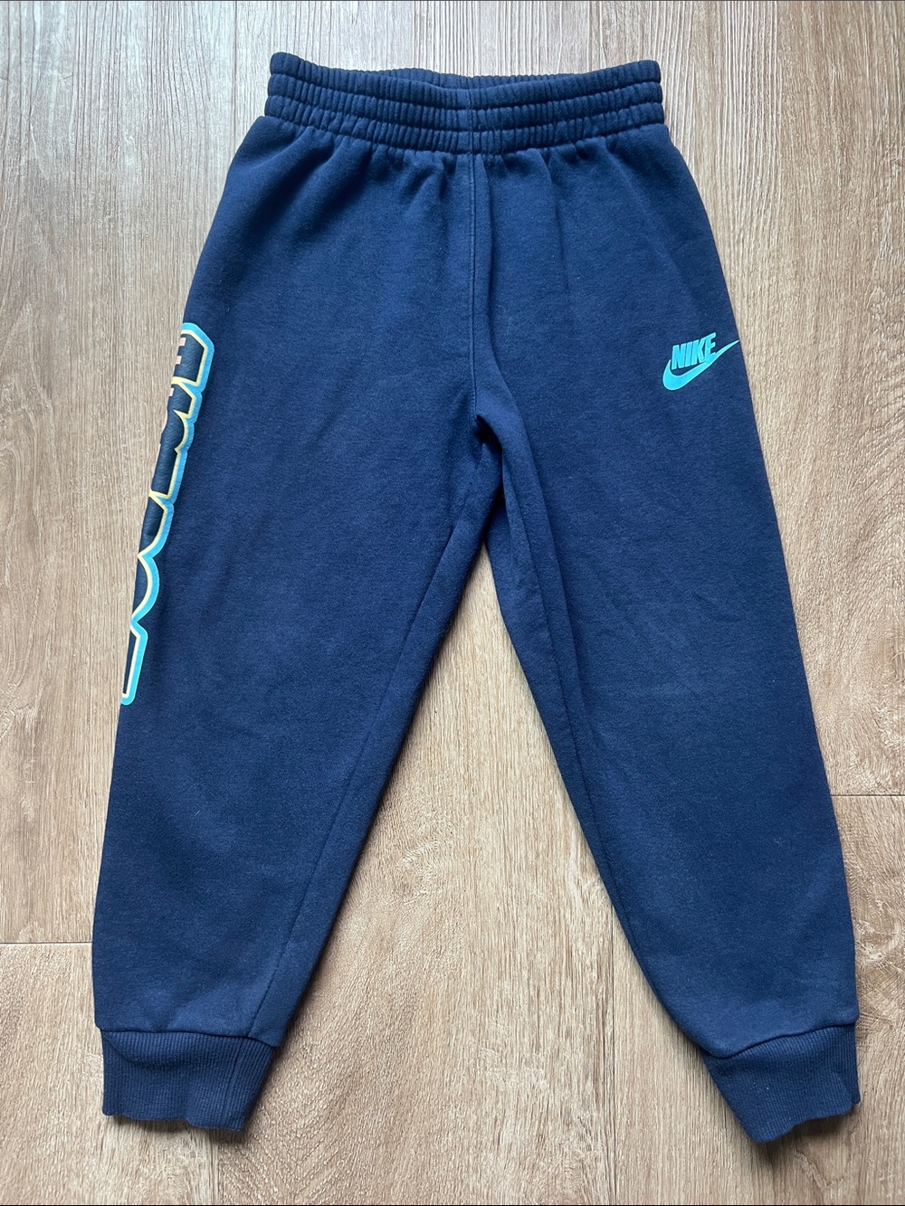 Nike Kids Navy Blue Joggers with Teal Nike Swoosh and Side Logo Size 6
